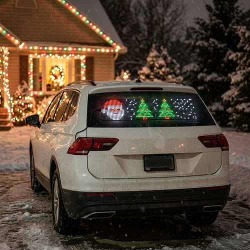 Santa and Christmas trees on an LED display in an SUV rear window